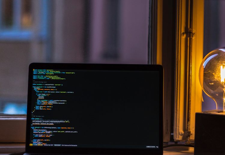 a computer screen in a dark room